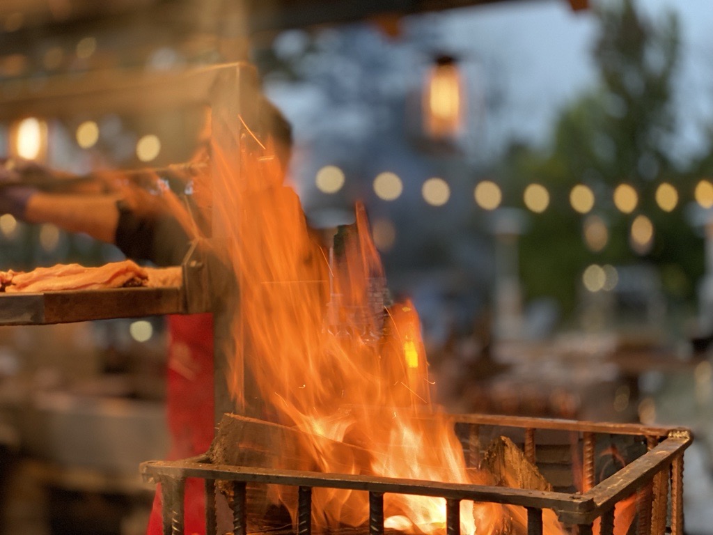 Private farm retreat — outdoor evening fire and grill